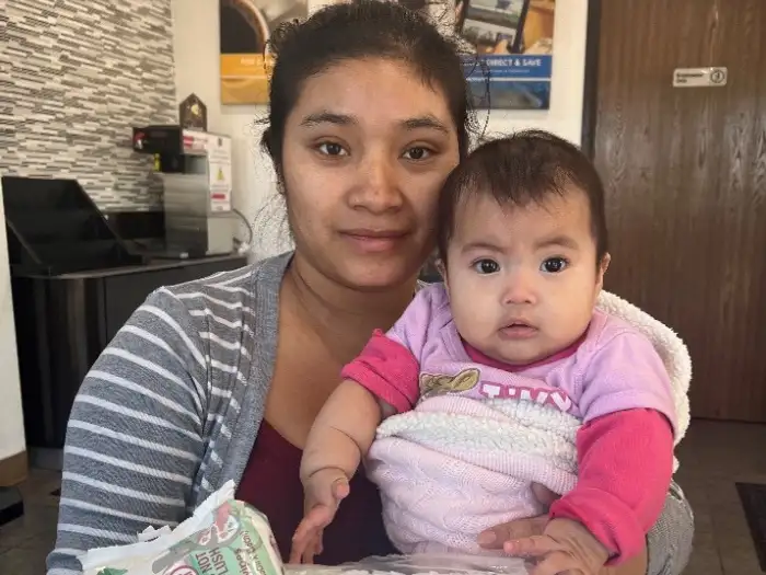 Mom and daughter receiving diapers